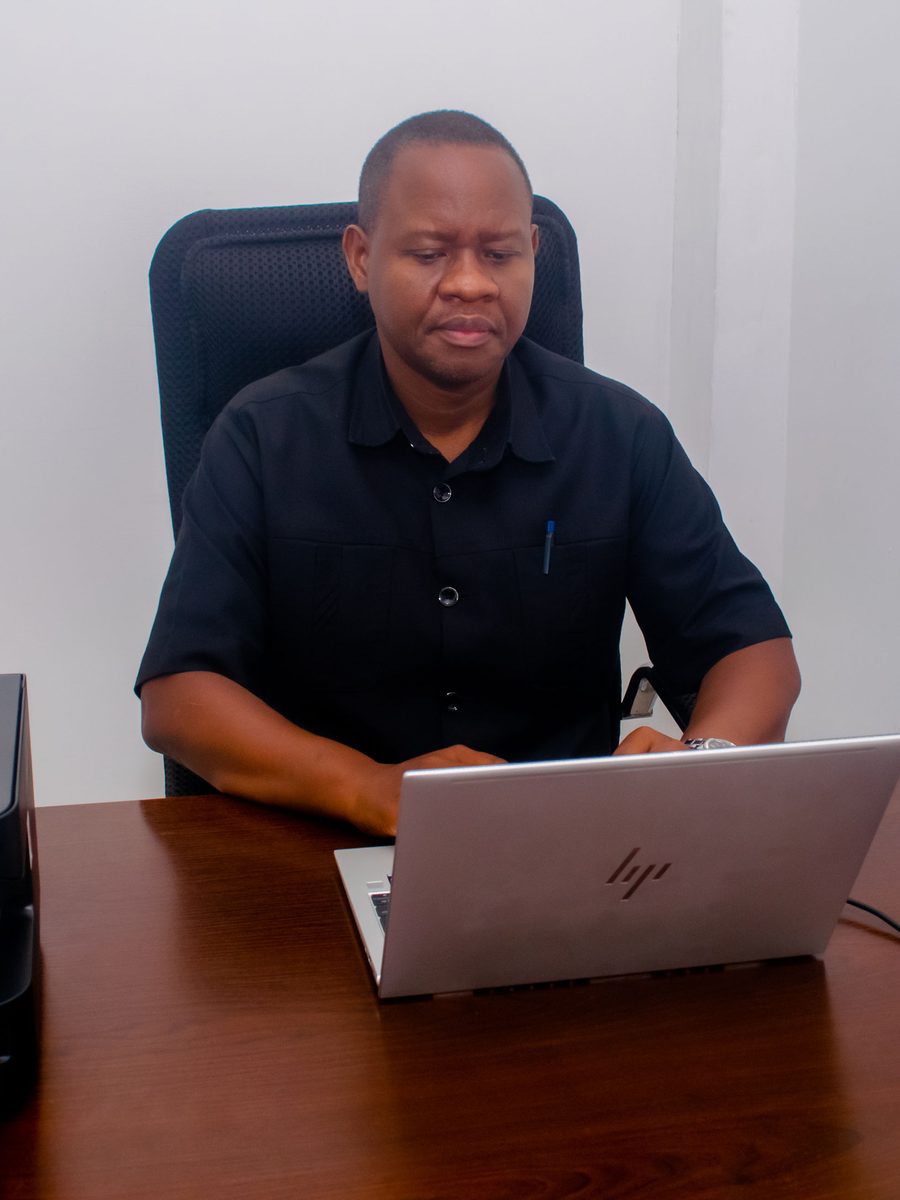 Geofrey Kidindima, BSI Finance Founder and CEO, at work in the Tegeta office